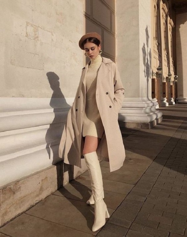 Váy body đen xẻ 2 bên phối với giày boot cổ cao