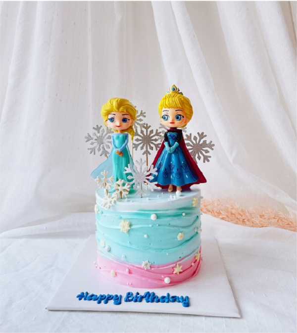 Bánh kem hình Elsa và Anna kết hợp trang trí hoa tuyết.
