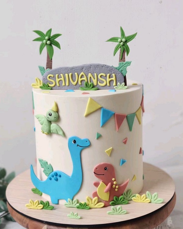 Mẫu bánh sinh nhật bé trai trang trí hình khủng long hoạt hình.